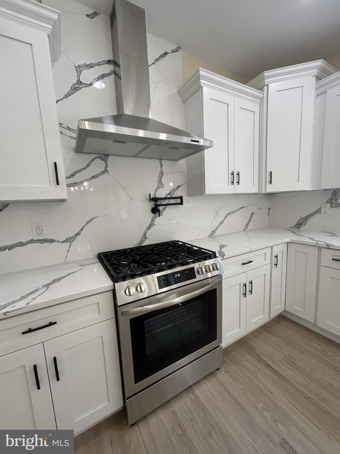 1178 South Spring Road Vineland, NJ 08361 - Photo 18 of 45 a kitchen with white cabinets and appliances