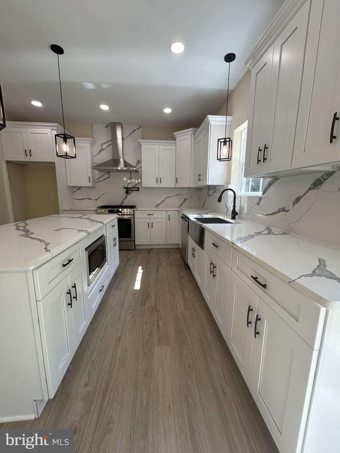 1178 South Spring Road Vineland, NJ 08361 - Photo 21 of 45 a large kitchen with stainless steel appliances kitchen island a large island in the center