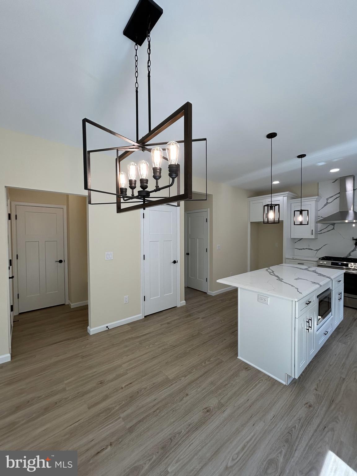 1178 South Spring Road Vineland, NJ 08361 - Photo 26 of 45 a kitchen with stainless steel appliances a white stove top oven and a chandelier