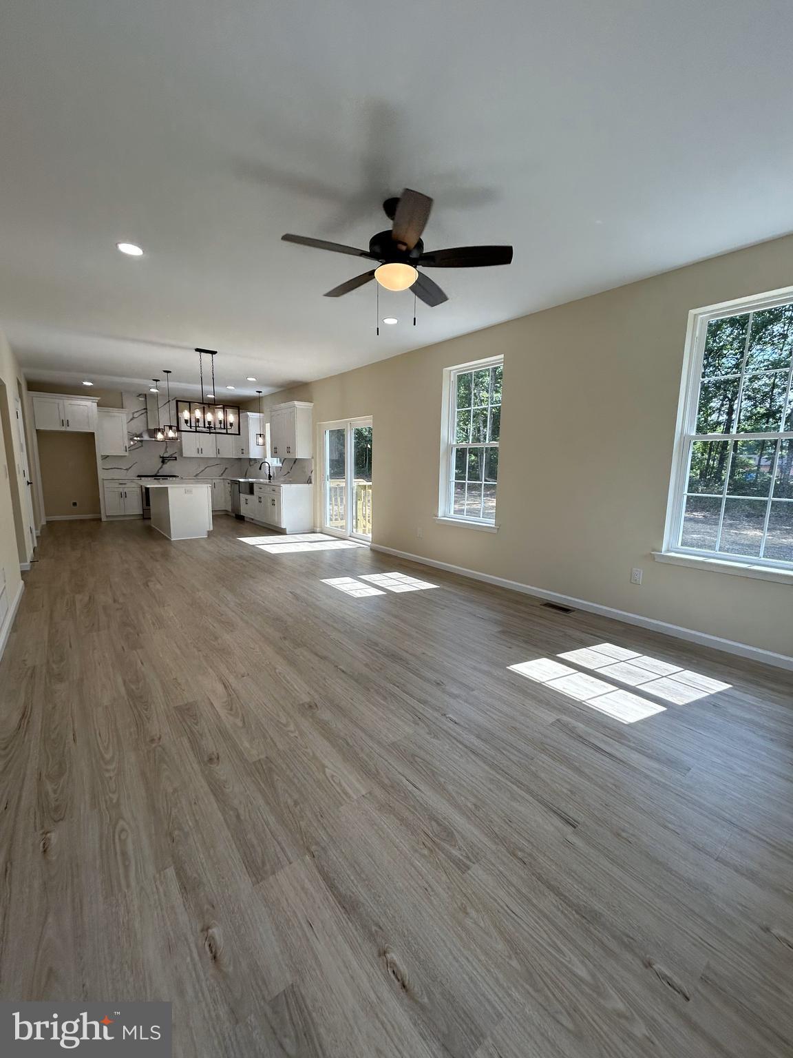 1178 South Spring Road Vineland, NJ 08361 - Photo 30 of 45 a view of empty room with wooden floor and ceiling fan