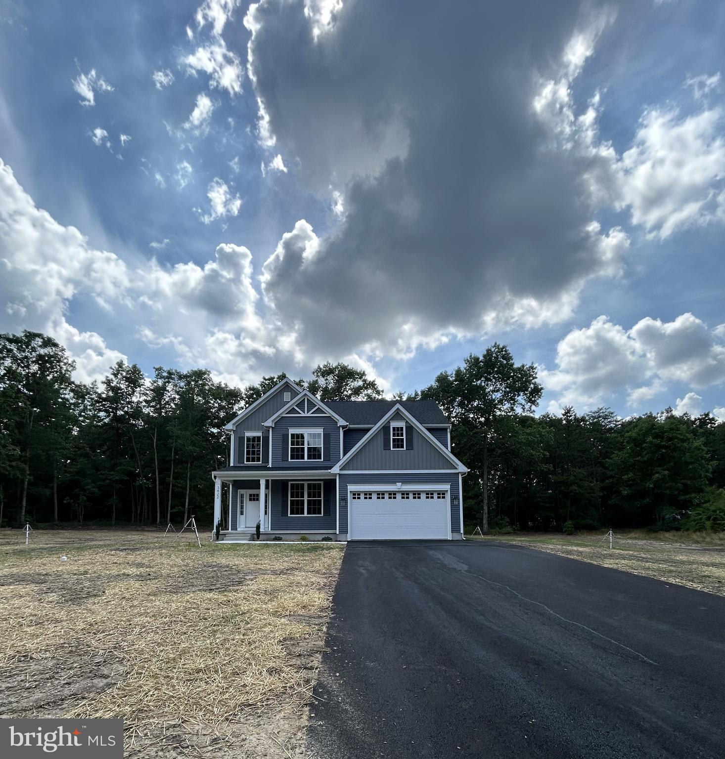 1178 South Spring Road Vineland, NJ 08361 - Photo 3 of 45 a front view of a house with a yard and trees