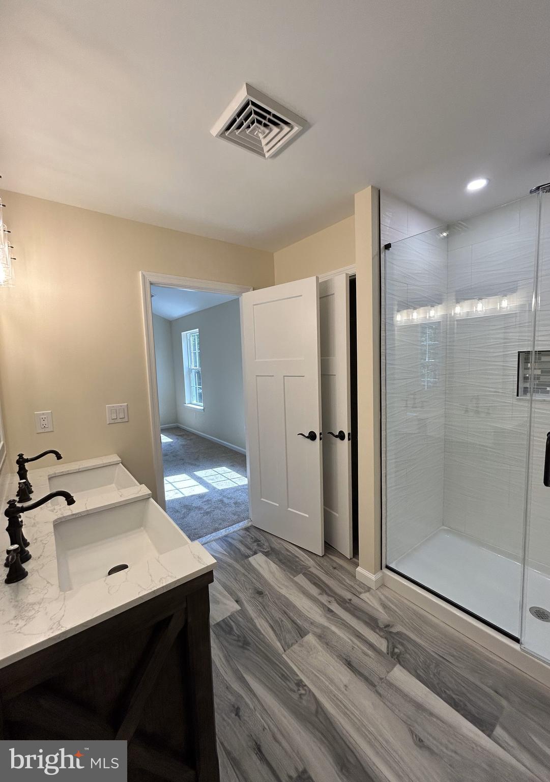 1178 South Spring Road Vineland, NJ 08361 - Photo 43 of 45 a view of a bathroom with a sink mirror and shower