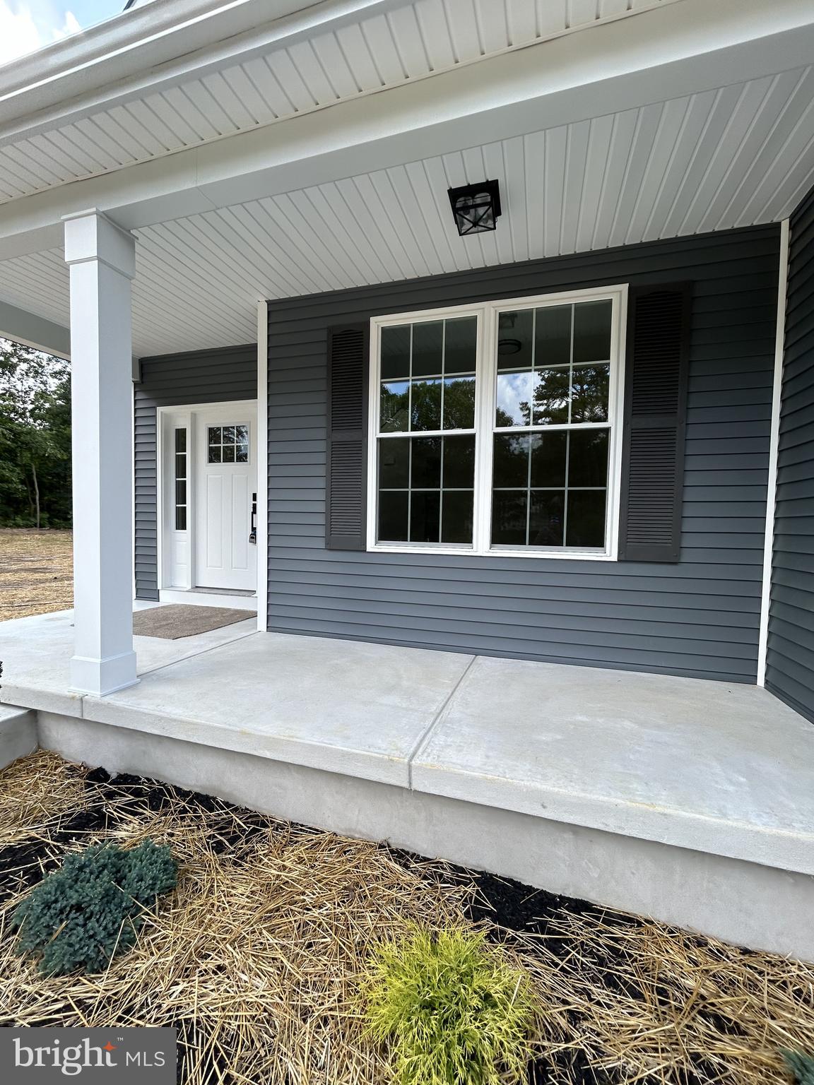 1178 South Spring Road Vineland, NJ 08361 - Photo 8 of 45 a front view of a house with a yard and wooden floor