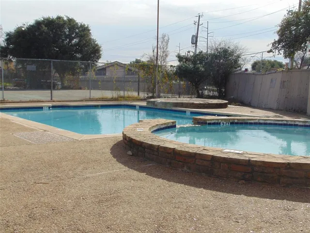 a view of a swimming pool with a lake view