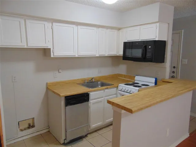 a kitchen with a stove and a microwave