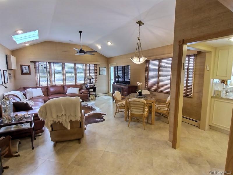 3421 Turf Road Oceanside, NY 11572 - Photo 20 of 50 a living room with furniture and a chandelier
