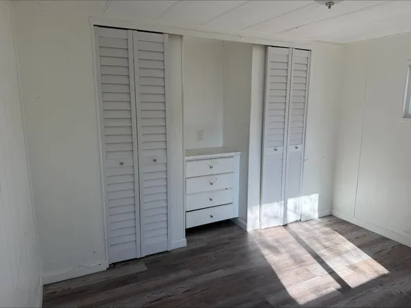 wooden floor and closet in a room