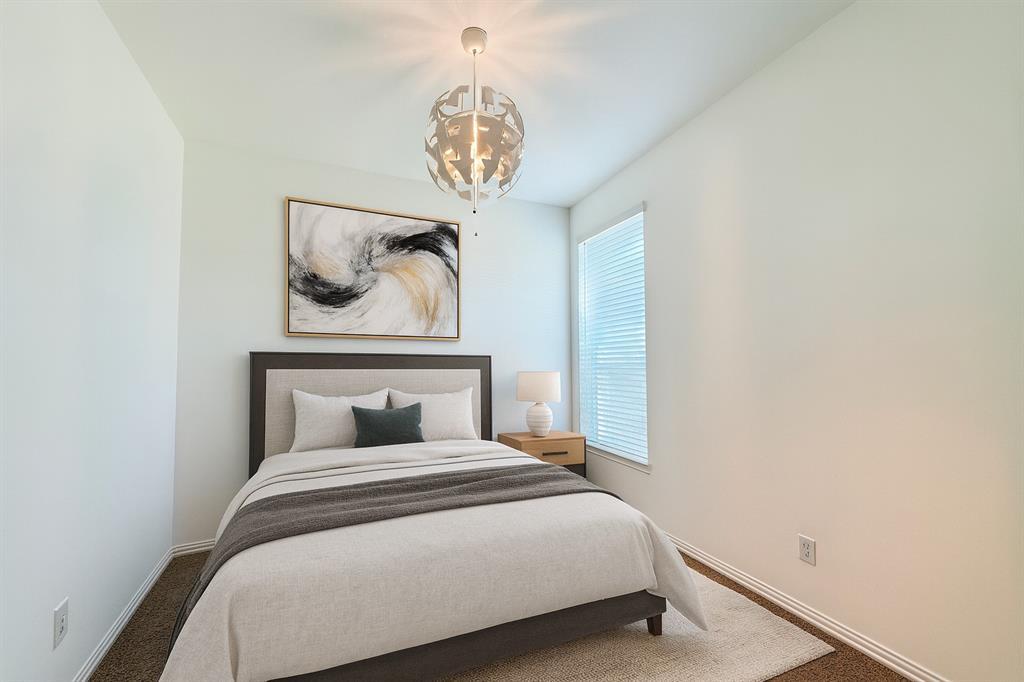 1336 Morning View Road Georgetown, TX 78628 - Photo 7 of 40 A well-appointed sleeping area features a single window, plush carpet flooring, and a contemporary ceiling light fixture.