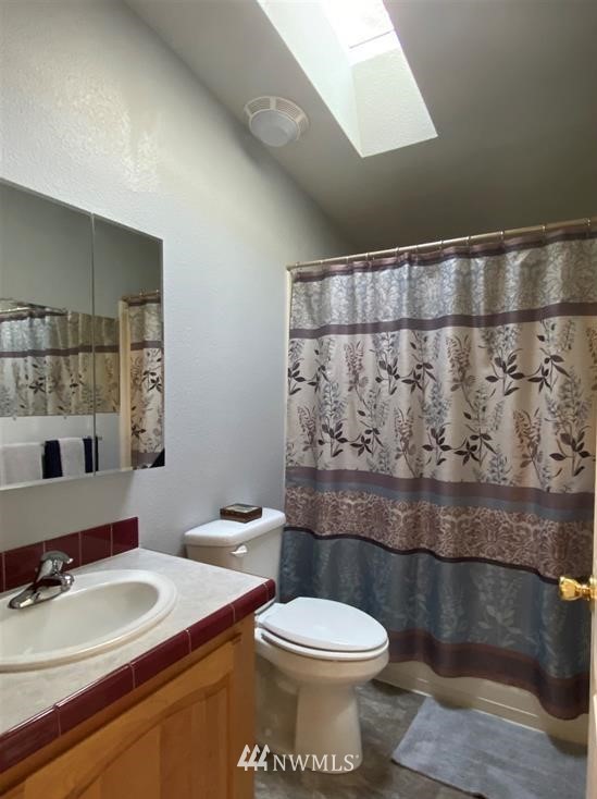 292 Fasola Road Sequim, WA 98382 - Photo 22 of 33 a bathroom with a toilet a sink and mirror