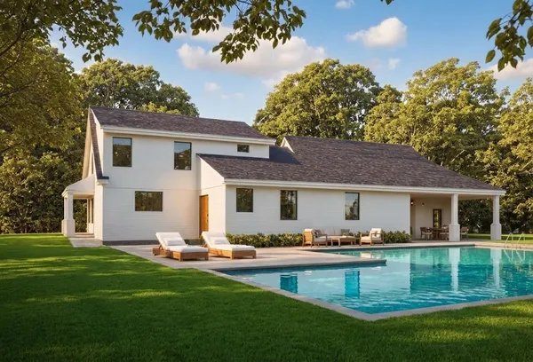 a front view of house with yard and outdoor seating
