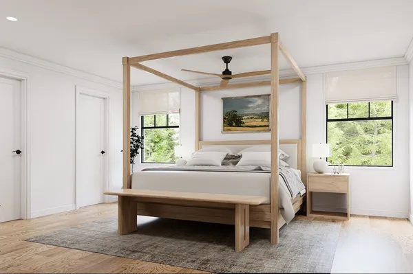 a bedroom with a bed and a window