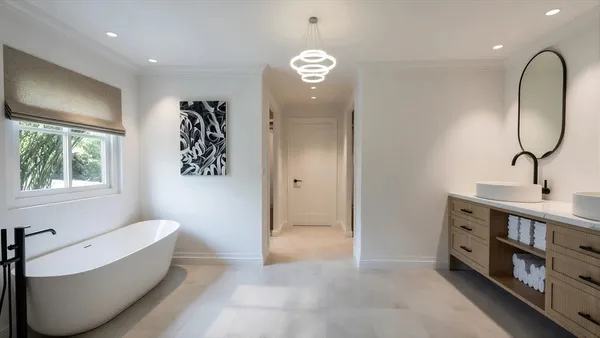 a spacious bathroom with a bathtub and a window