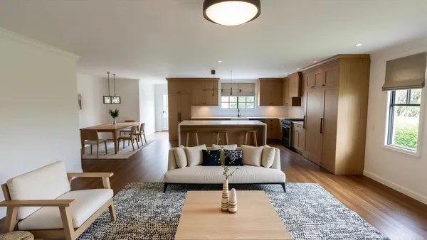 a living room with a couch and a table