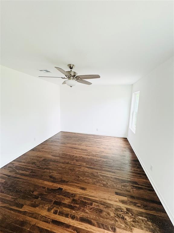 6442 Latta Street Dallas, TX 75227 - Photo 12 of 12 a view of a room with wooden floor