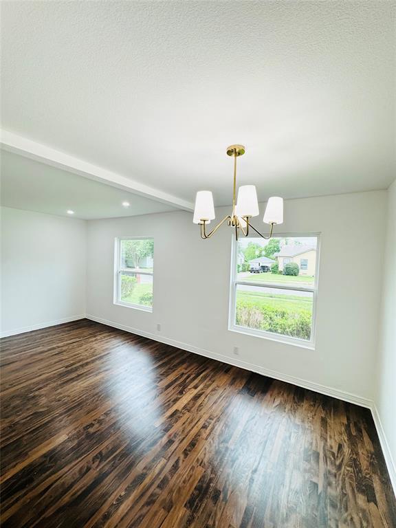 6442 Latta Street Dallas, TX 75227 - Photo 3 of 12 a view of a room with wooden floor and window
