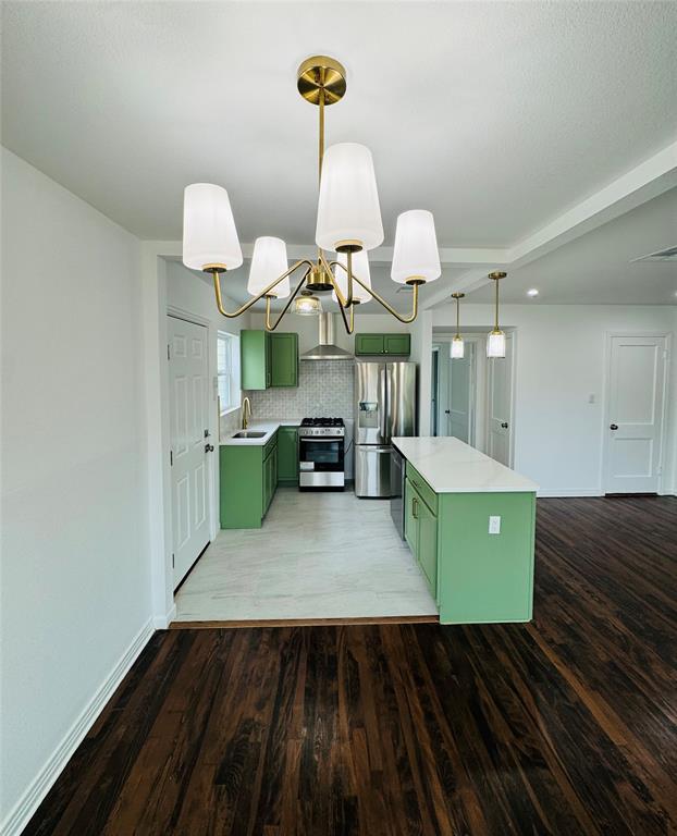6442 Latta Street Dallas, TX 75227 - Photo 4 of 12 a view of kitchen and hall with wooden floor