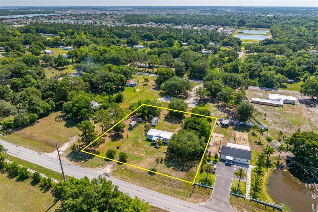 7308 Boyette Road Wesley Chapel, FL 33545 - Photo 20 of 36 an aerial view of residential house with outdoor space