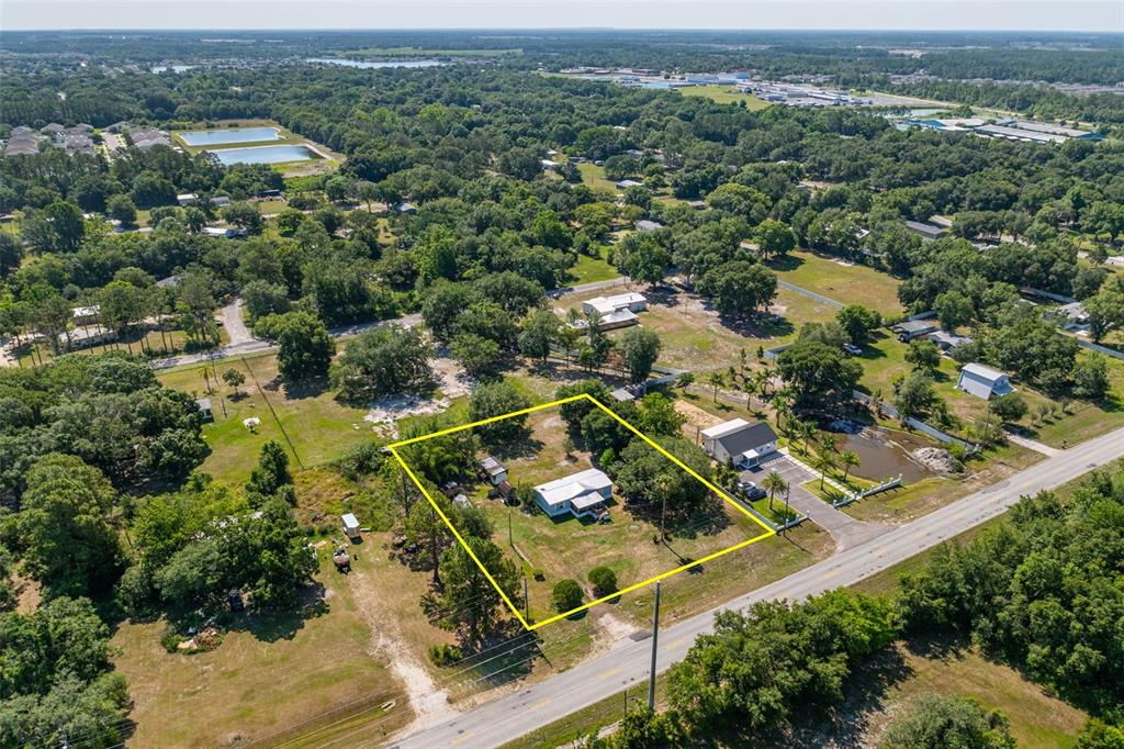 7308 Boyette Road Wesley Chapel, FL 33545 - Photo 21 of 36 an aerial view of residential houses with outdoor space