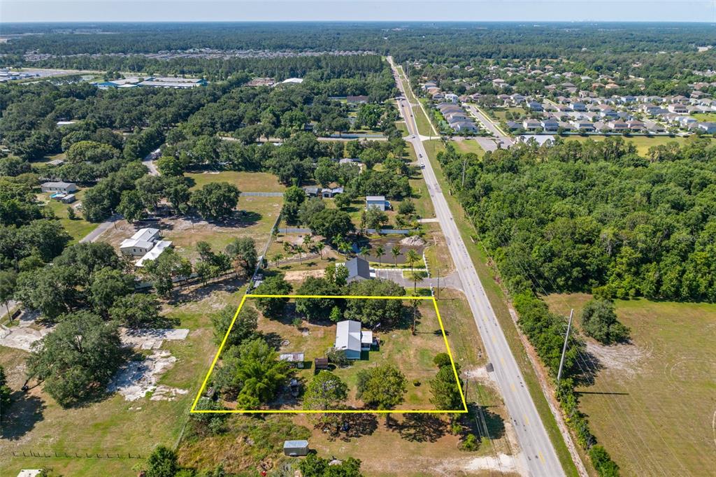7308 Boyette Road Wesley Chapel, FL 33545 - Photo 23 of 36 an aerial view of residential houses with outdoor space