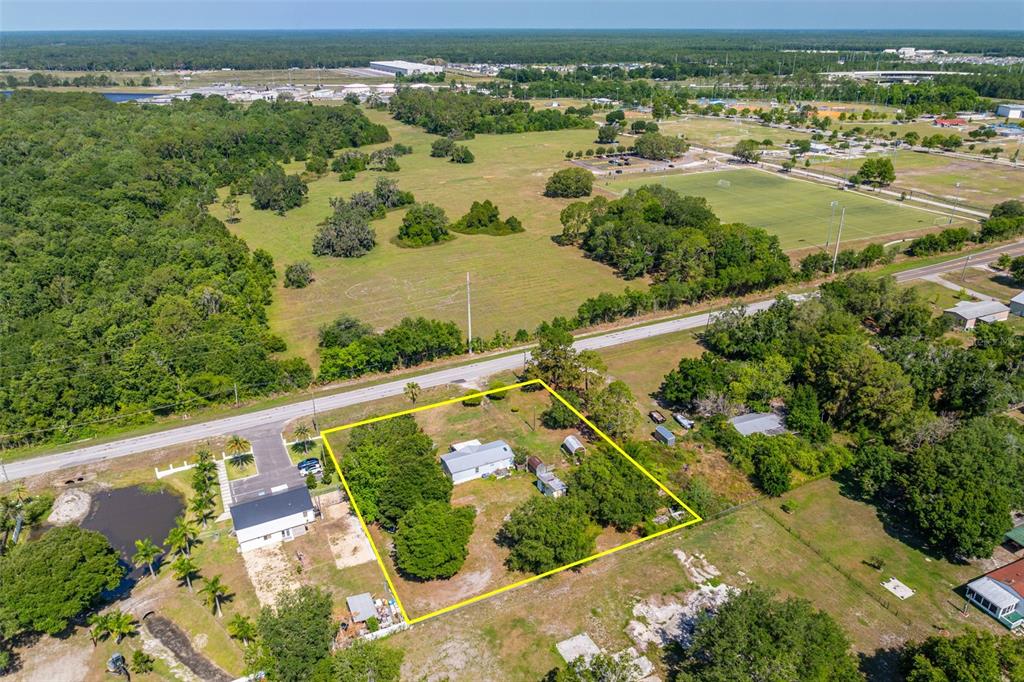 7308 Boyette Road Wesley Chapel, FL 33545 - Photo 28 of 36 an aerial view of residential houses with outdoor space and river