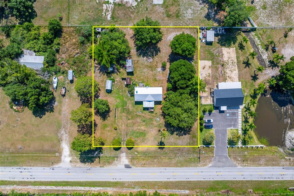 7308 Boyette Road Wesley Chapel, FL 33545 - Photo 29 of 36 an aerial view of houses with yard
