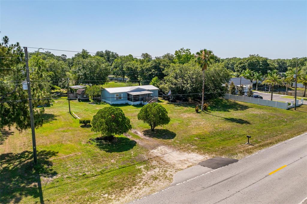 7308 Boyette Road Wesley Chapel, FL 33545 - Photo 3 of 36 a view of a swimming pool with a patio