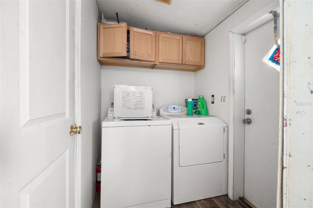 7308 Boyette Road Wesley Chapel, FL 33545 - Photo 31 of 36 a utility room with dryer and washer