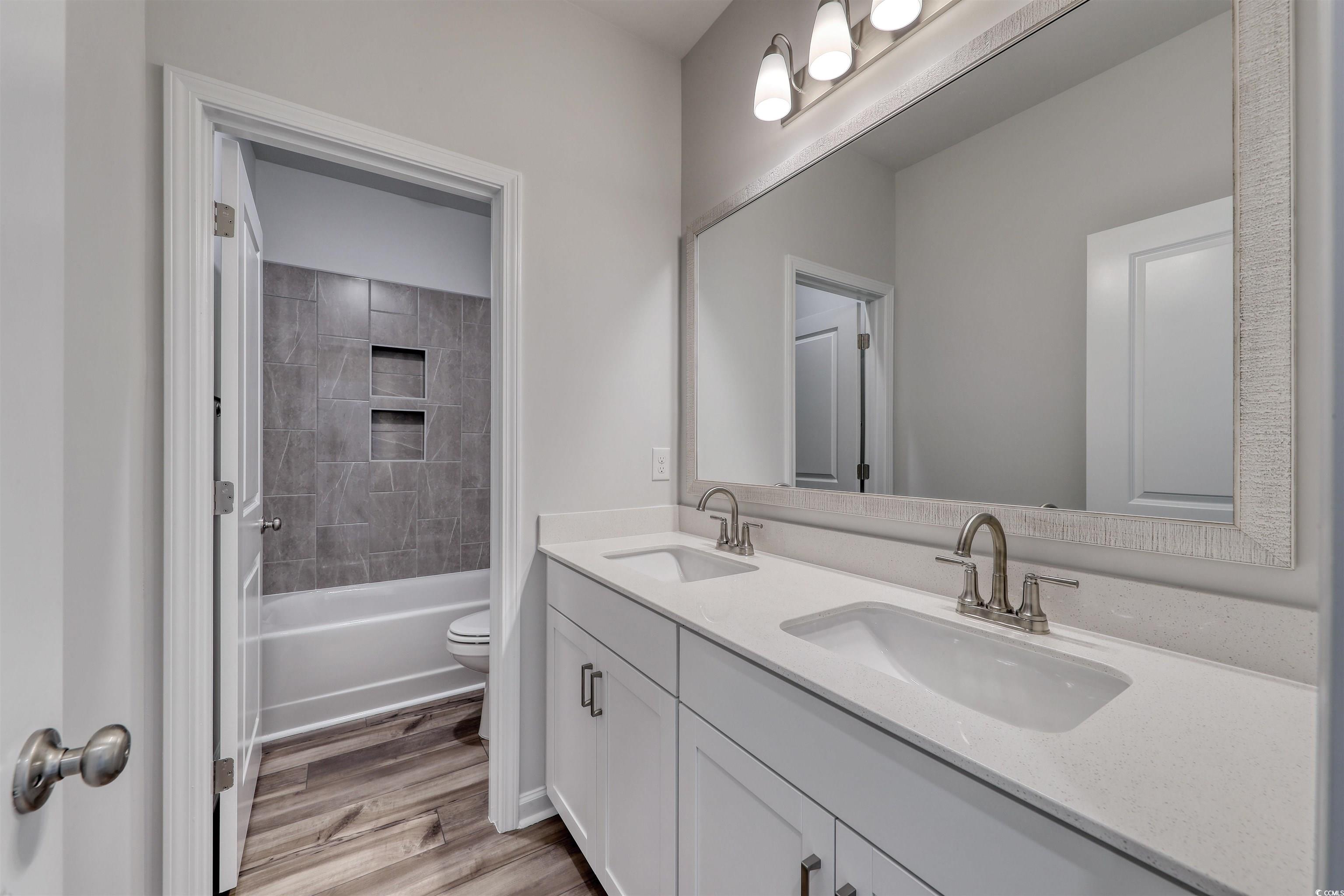 768 Enchantment Loop Myrtle Beach, SC 29588 - Photo 17 of 40 Full bathroom featuring hardwood / wood-style floo