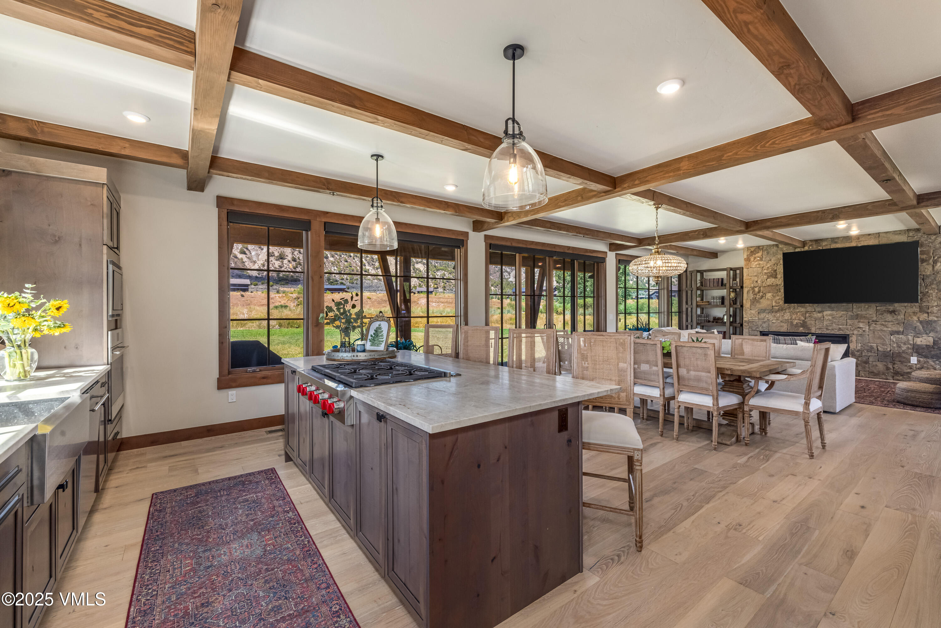 664 Hunters View Lane Eagle, CO 81631 - Photo 11 of 35 a kitchen with stainless steel appliances granite countertop a stove and a wooden floors