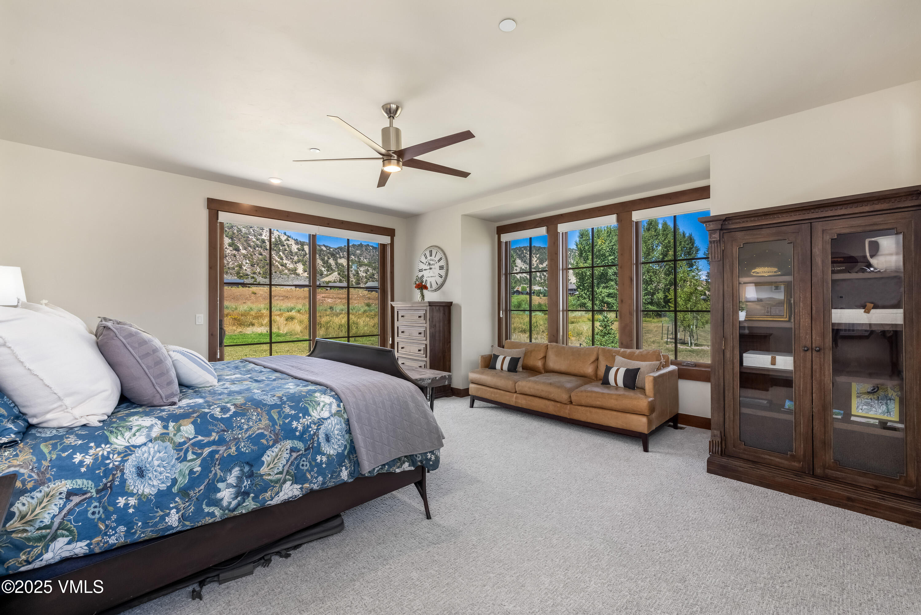 664 Hunters View Lane Eagle, CO 81631 - Photo 15 of 35 a bedroom with a large bed and a couch