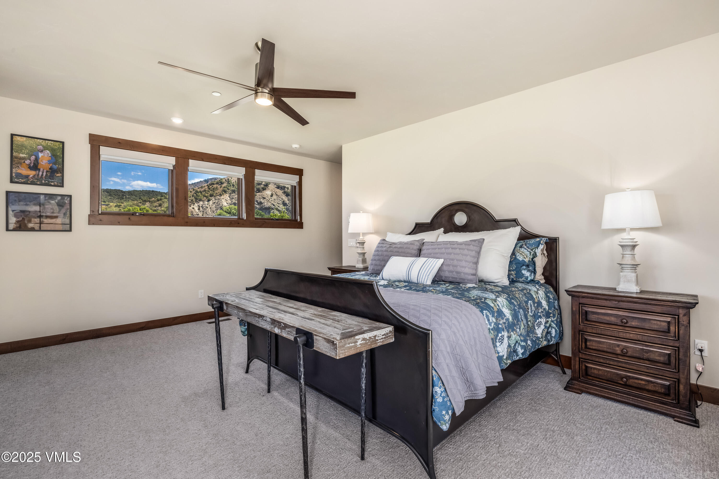 664 Hunters View Lane Eagle, CO 81631 - Photo 16 of 35 a bedroom with a bed and a painting on the wall