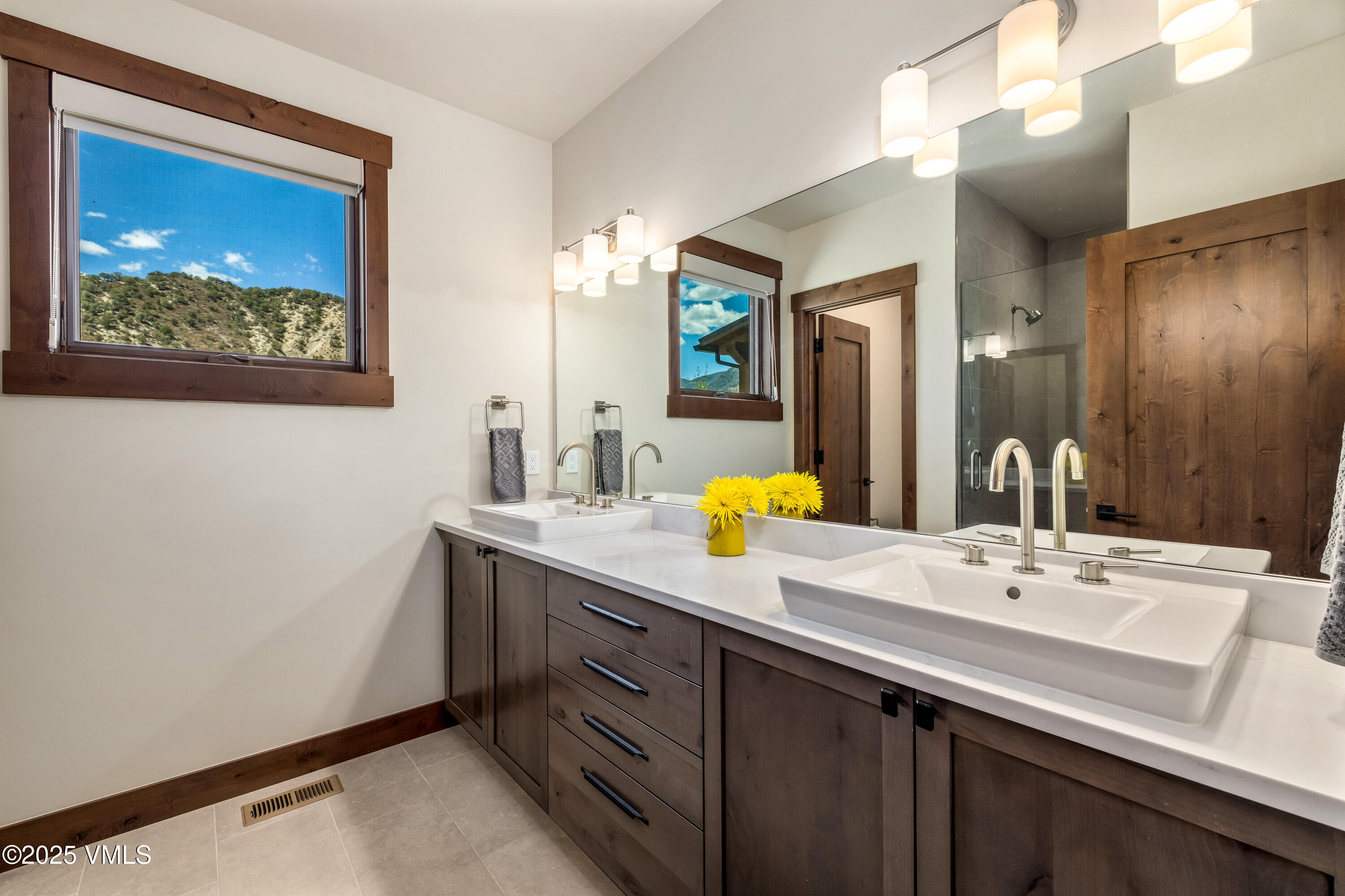 664 Hunters View Lane Eagle, CO 81631 - Photo 17 of 35 a bathroom with a sink double vanity and a mirror