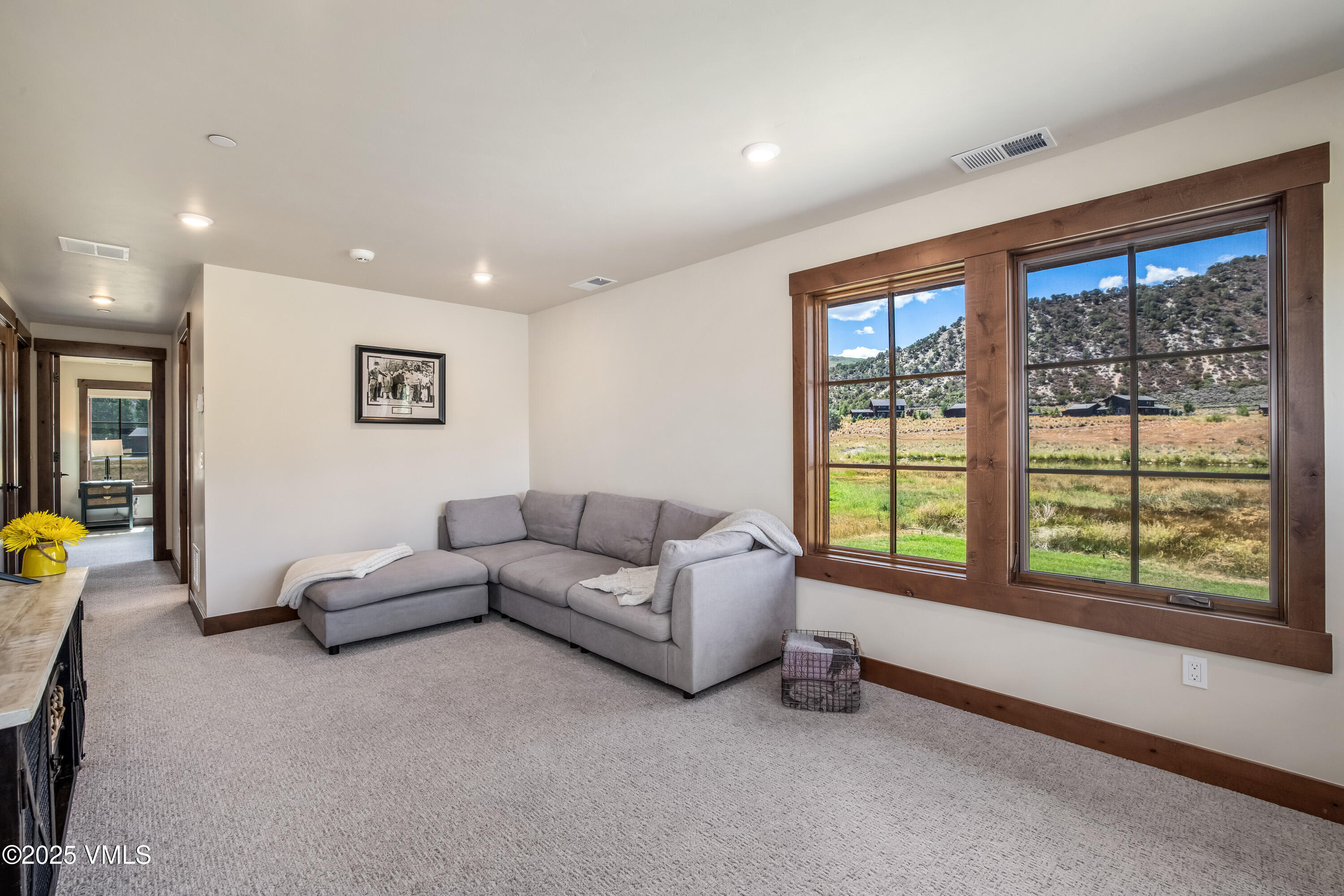 664 Hunters View Lane Eagle, CO 81631 - Photo 19 of 35 a living room with furniture and a large window