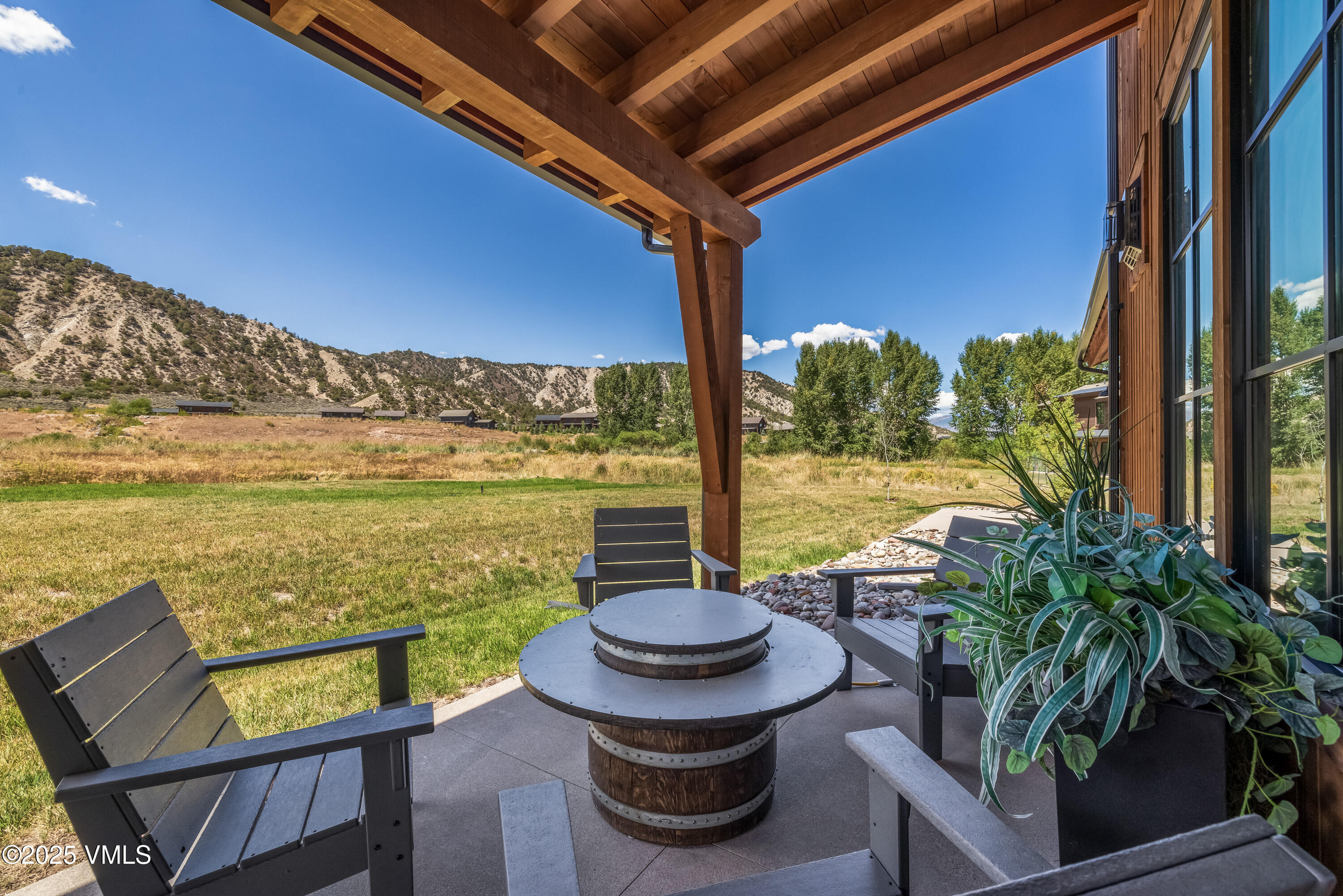 664 Hunters View Lane Eagle, CO 81631 - Photo 27 of 35 a view of a balcony with chairs and a table
