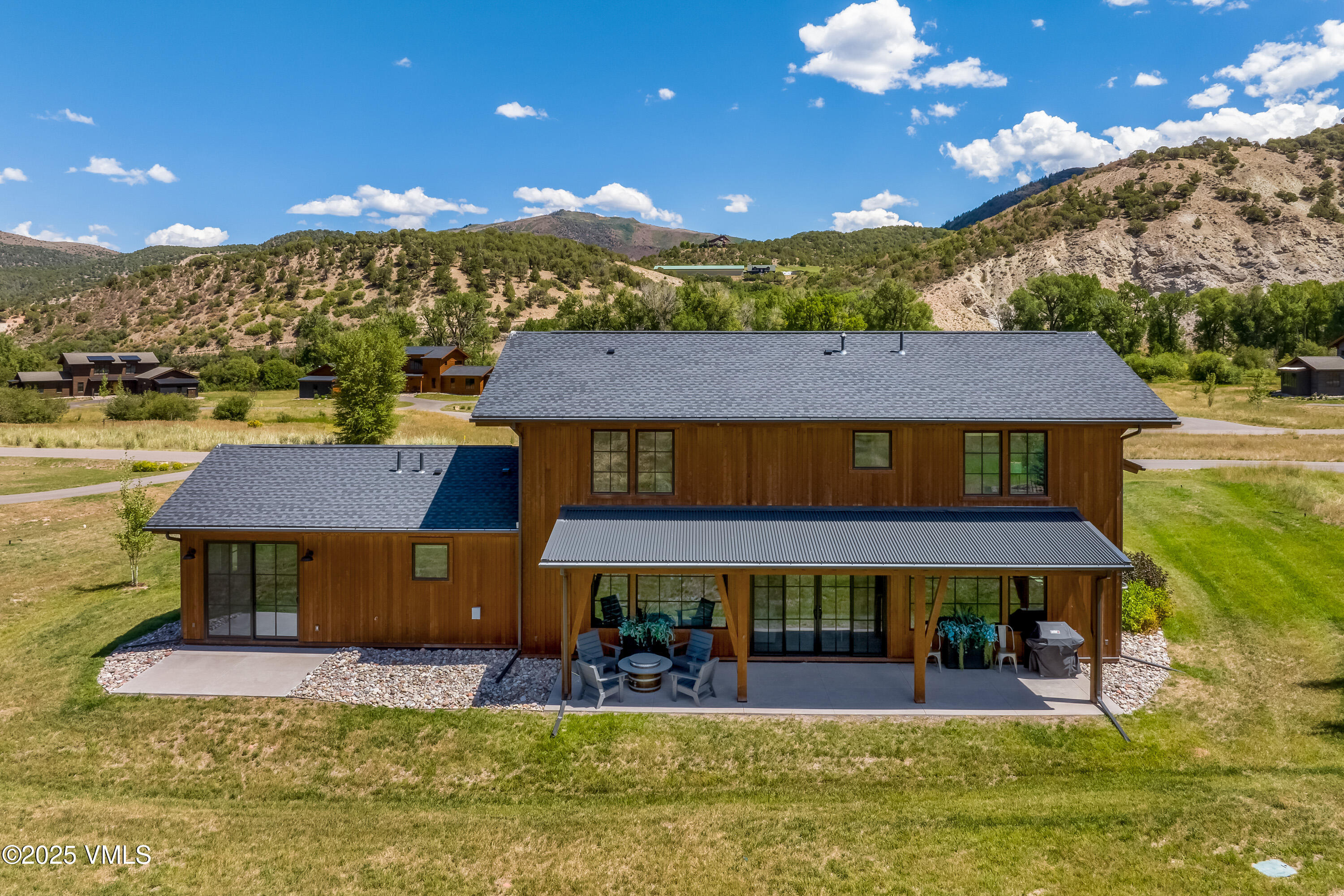 664 Hunters View Lane Eagle, CO 81631 - Photo 30 of 35 a view of a house with swimming pool and a yard
