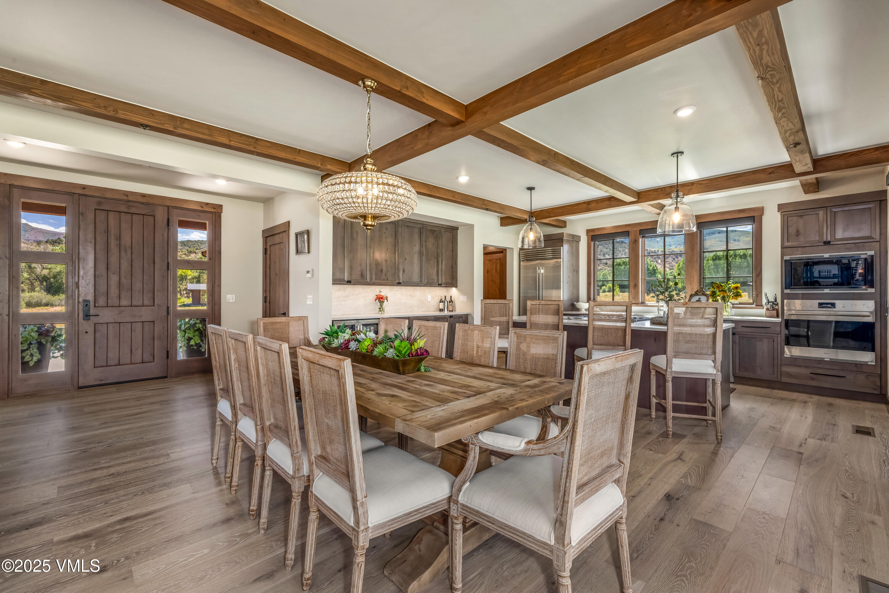 664 Hunters View Lane Eagle, CO 81631 - Photo 5 of 35 a view of a dining room with furniture and wooden floor
