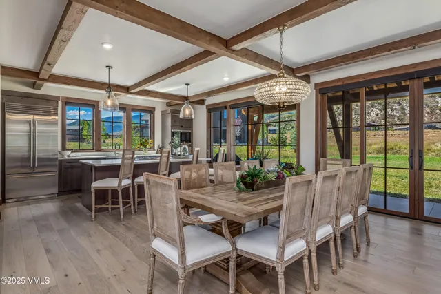 a view of a dining room with furniture window and wooden floor