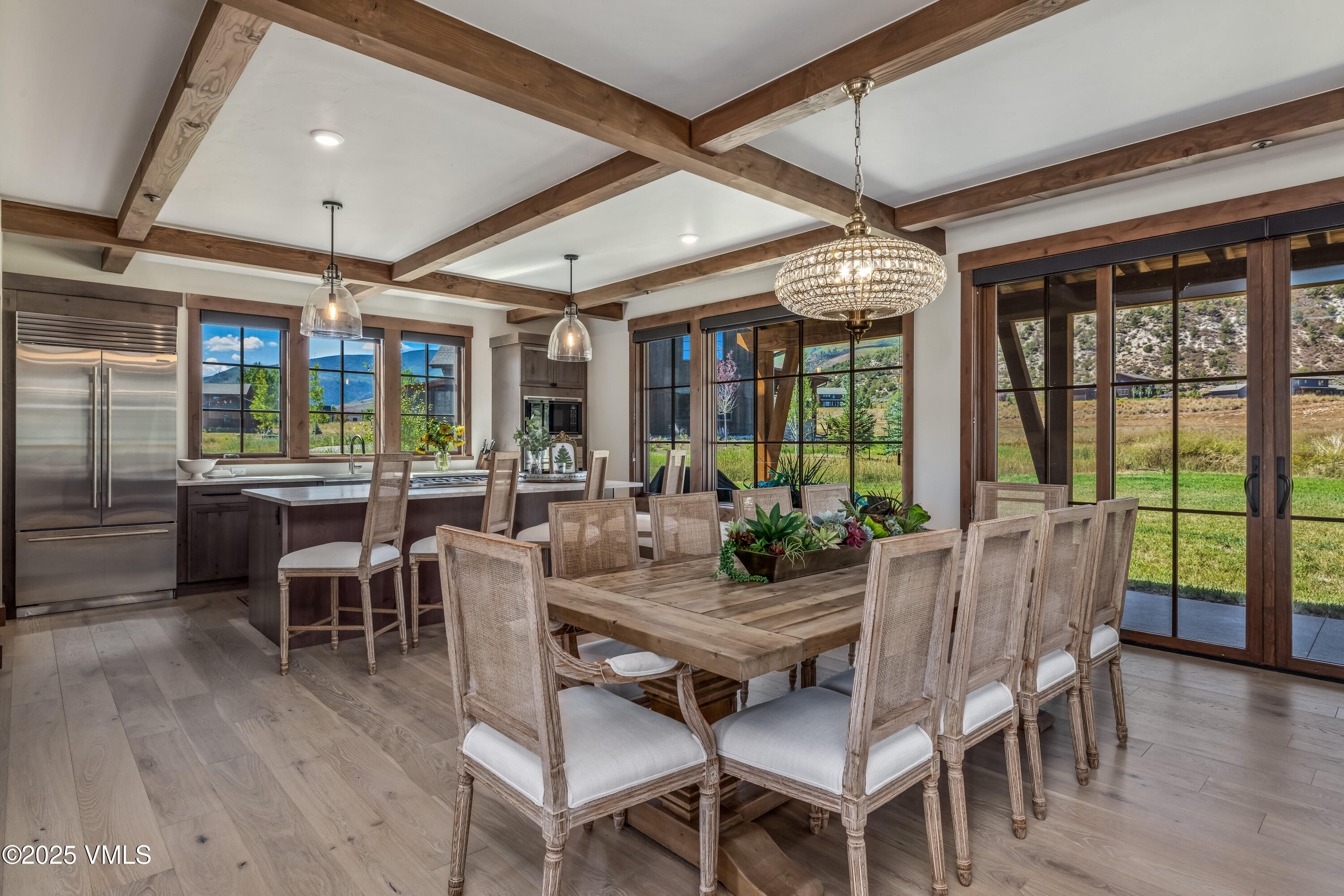 664 Hunters View Lane Eagle, CO 81631 - Photo 6 of 35 a view of a dining room with furniture window and wooden floor