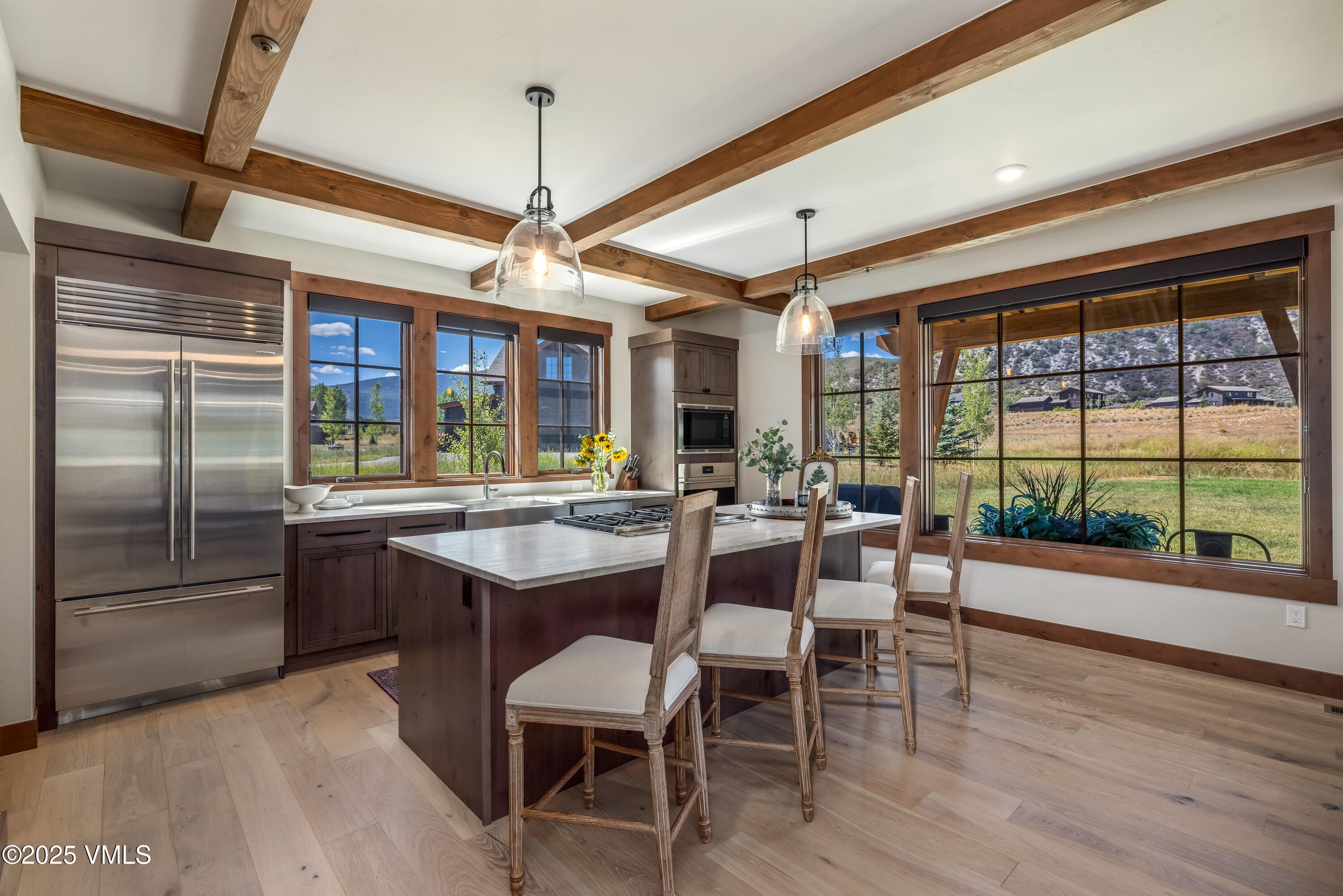 664 Hunters View Lane Eagle, CO 81631 - Photo 7 of 35 a dining area with a large window table and chairs