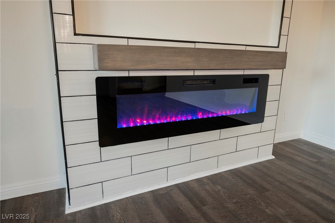 1706 Toltec Circle Henderson, NV 89014 - Photo 14 of 21 Detailed view of wood finished floors and a glass covered fireplace