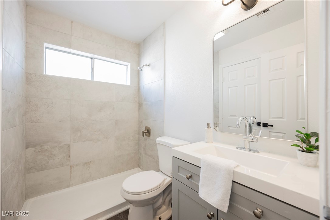 1706 Toltec Circle Henderson, NV 89014 - Photo 18 of 21 Full bathroom featuring vanity and a shower stall