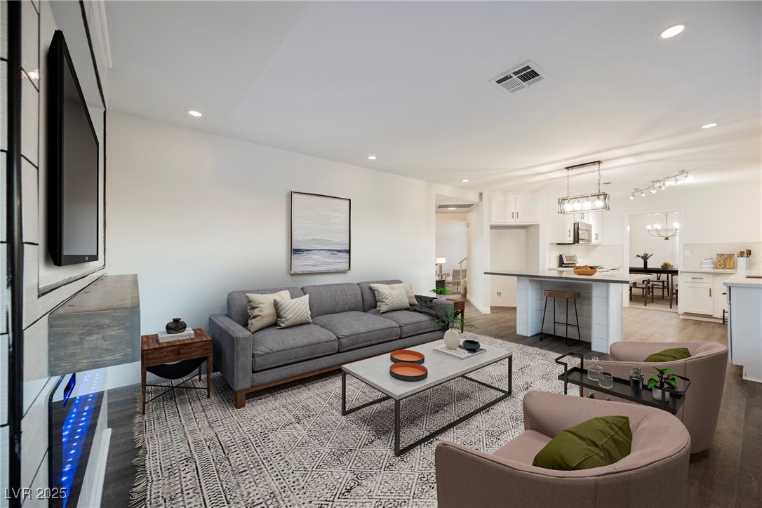 1706 Toltec Circle Henderson, NV 89014 - Photo 4 of 21 VIRTUALLY STAGED! Living area with light wood-style floors and recessed lighting