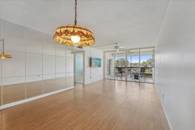 a view of a room with wooden floor