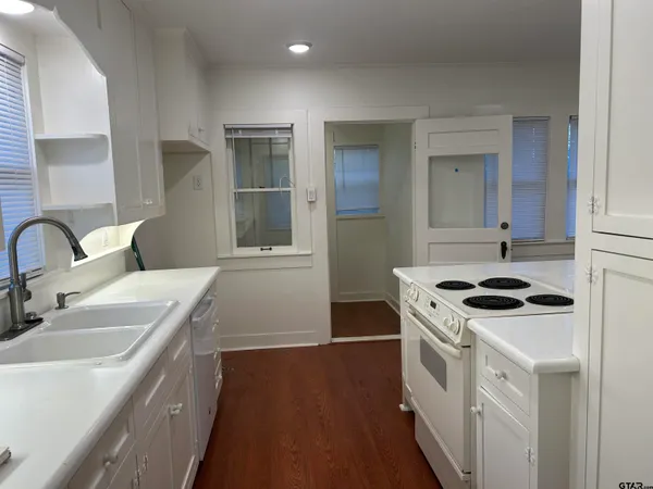 a kitchen with a stove and a sink