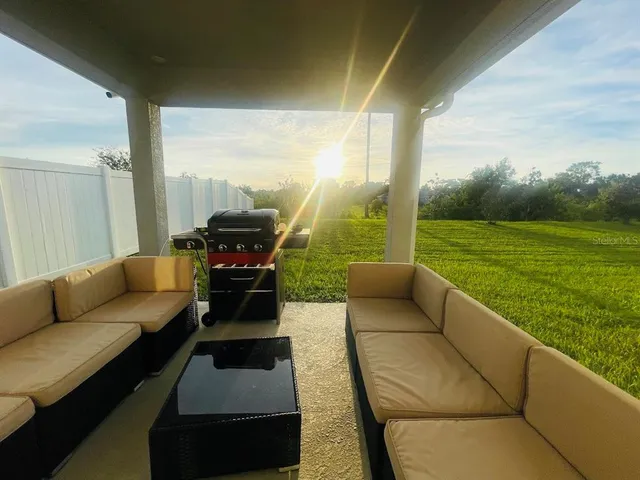 a living room with furniture and a garden