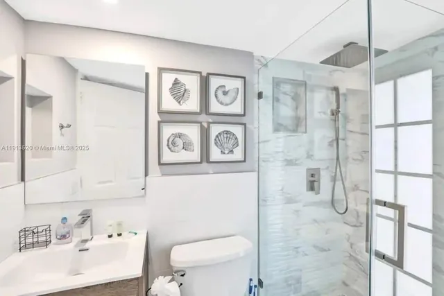 a bedroom with furniture and a flat screen tv