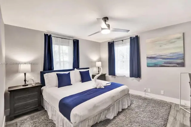 an aerial view of a house with a yard and outdoor seating