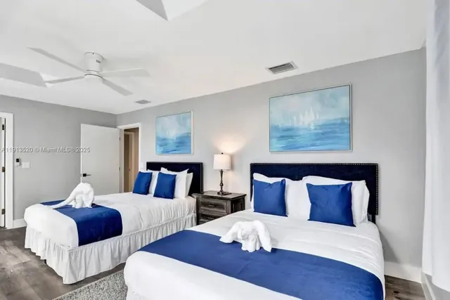 an aerial view of a house with garden space and street view