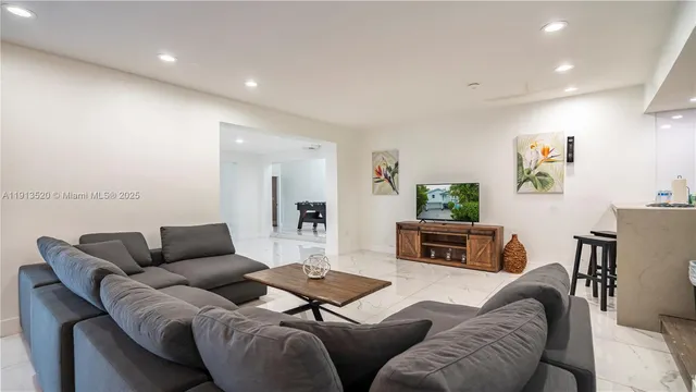 a bedroom with a bed and ceiling fan