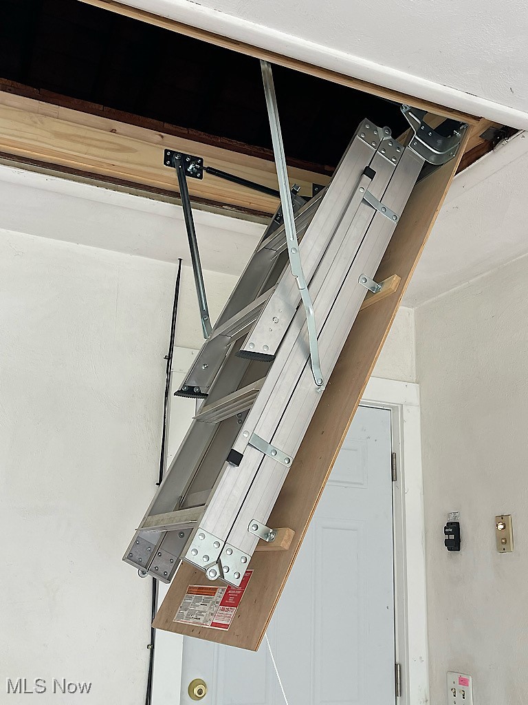 891 Sovereign Road Akron, OH 44303 - Photo 26 of 30 Garage ladder to attic storage